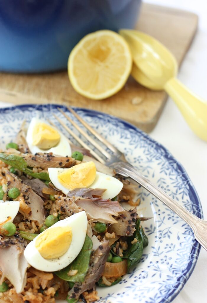 mackerel kedgeree on a blue and white plate with a silver fork