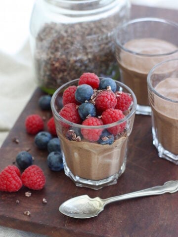 an Overnight Chocolate Chia Pudding that is deliciously velvety and creamy and has as much right at the breakfast table as it does for a sneaky after dinner treat. It's made with coconut milk (the drinking kind rather than the tinned kind) so it works if you need to avoid dairy PLUS the puddings also contain no refined sugar. And it's flexible too - we enjoyed it here topped with raspberries, blueberries and a sprinkle of cacao nibs, but it's also delicious with sliced bananas, greek yoghurt and a sprinkling of muesli; grapes, strawberries and pomegranate seeds