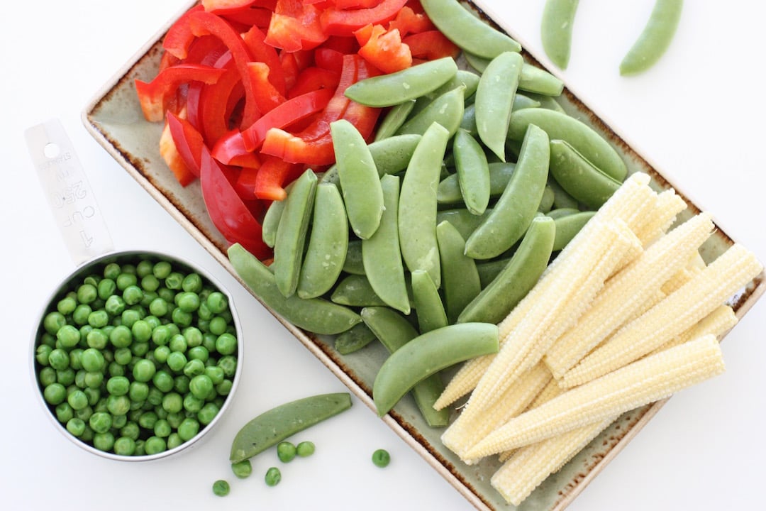 prepared vegetables on a green rectangular plate