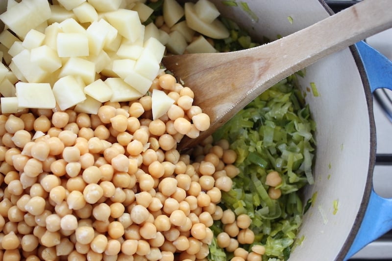 Ingredients for Chickpea and Leek Soup in a blue pan
