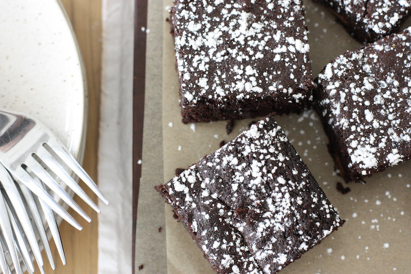 Chocolate brownies from above on a wooden board