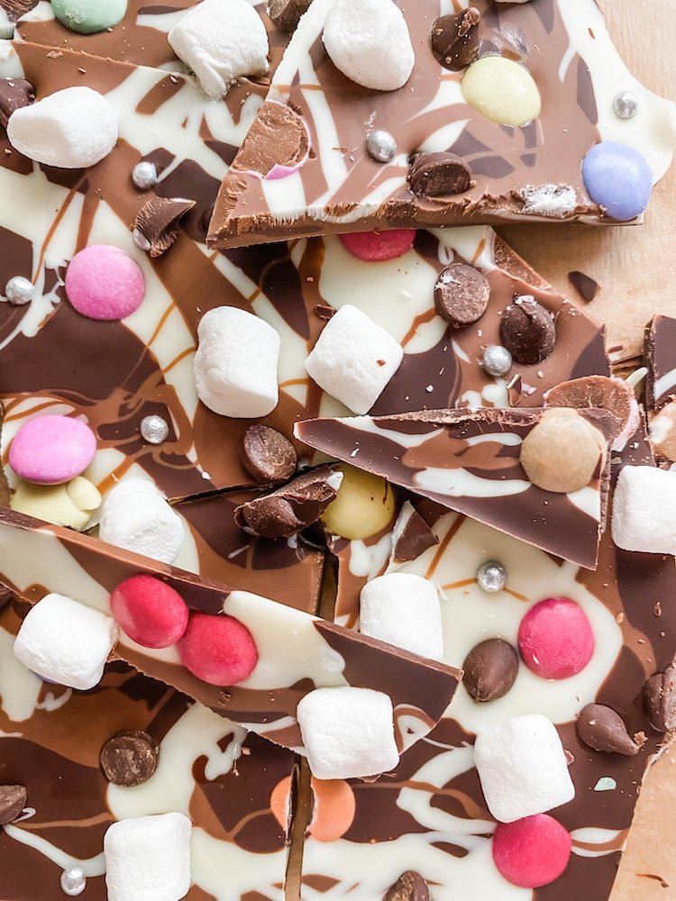Chocolate bark topped with smarties, marshmallows and chocolate chips