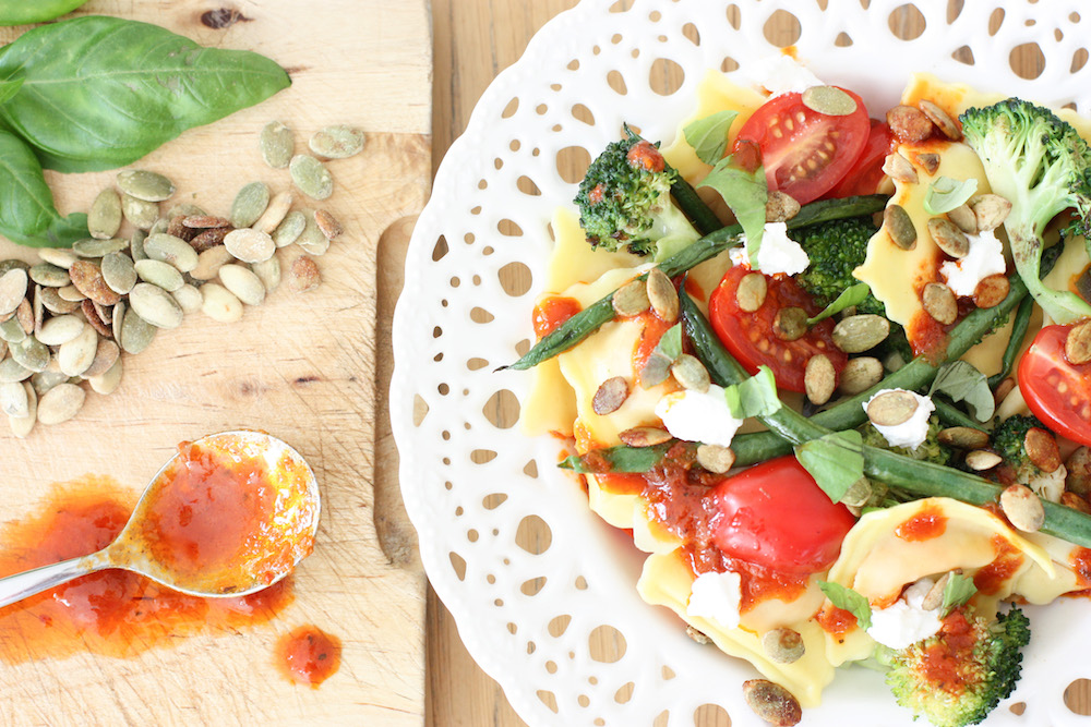 Harissa Ravioli in a white flat dish