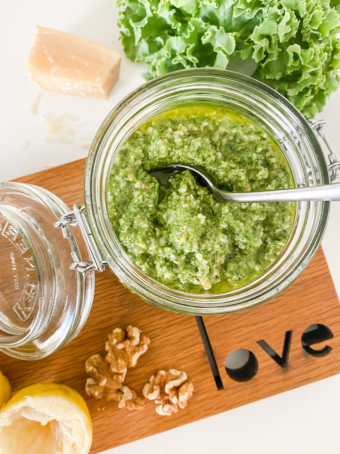 Kale Pesto in a jar with ingredients