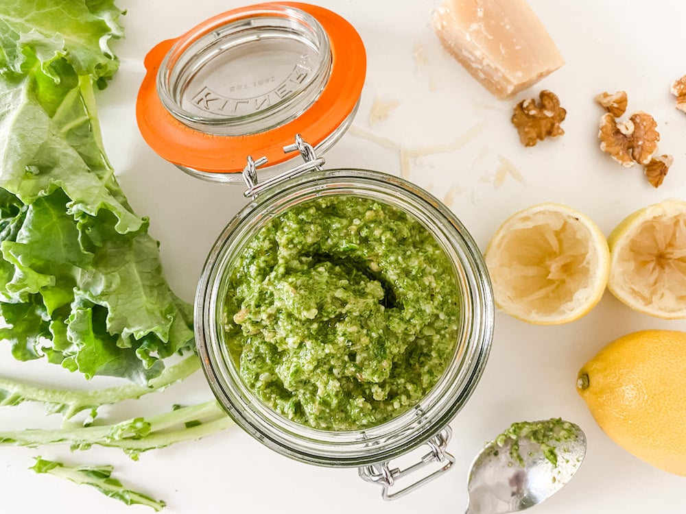 Kale Pesto in a jar with ingredients