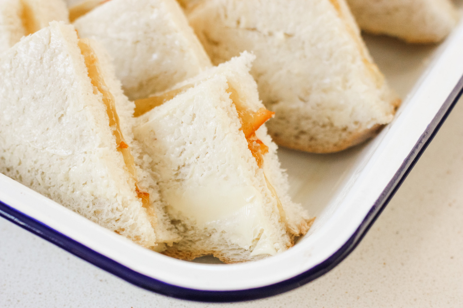 Marmalade bread and butter pudding in white enamel dish ready to cook