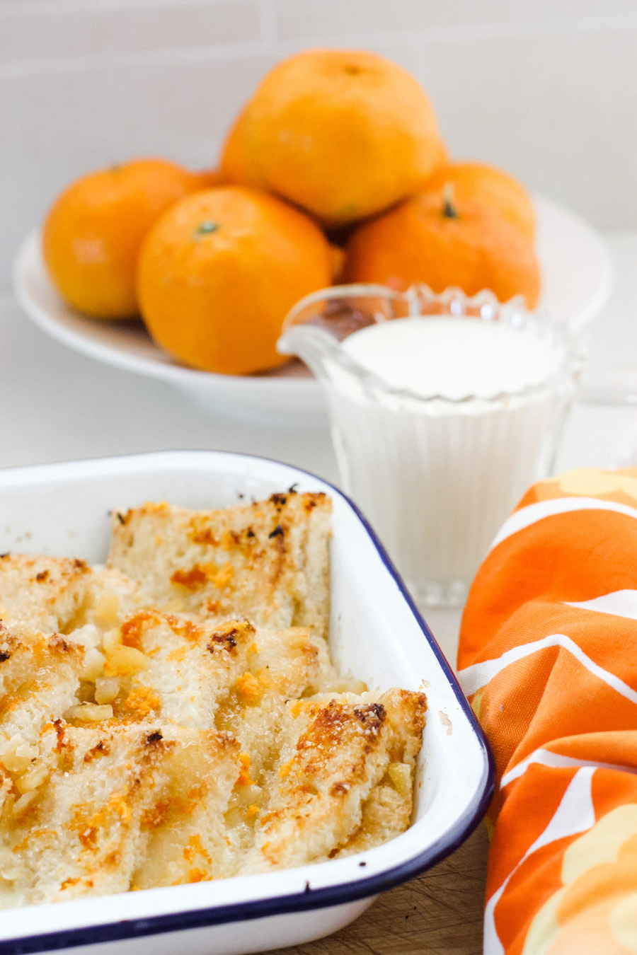 Marmalade bread and butter pudding in white enamel dish