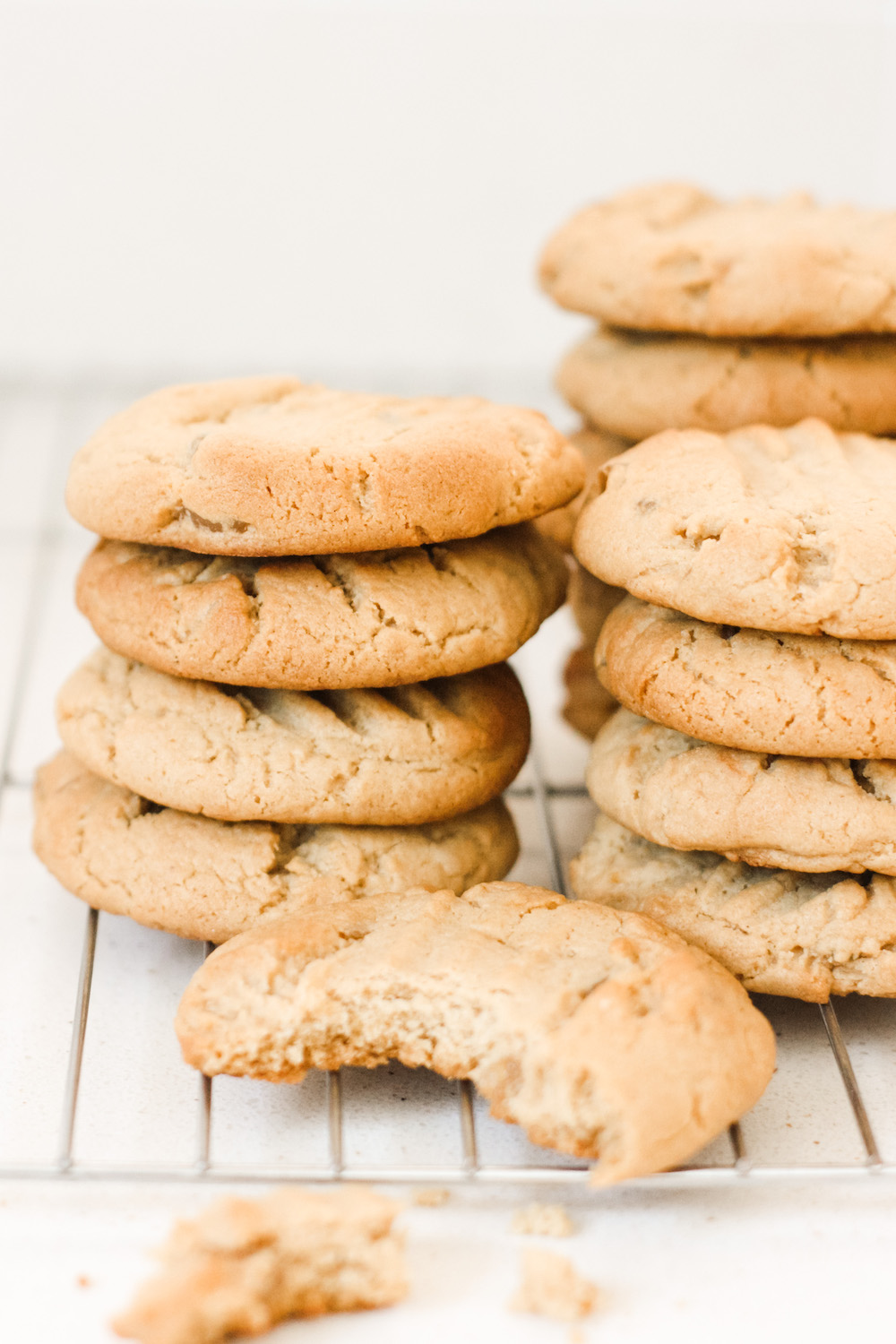 Piles of stem ginger cookies on a cooling rack