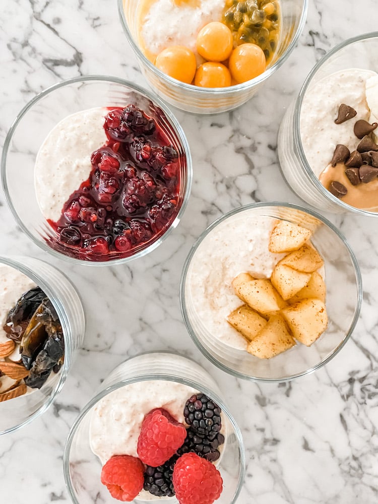 Overnight Oats with six different toppings in glass dishes