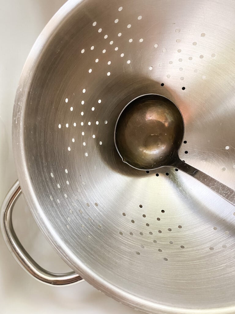 Ladle in a colander as a reminder to save the pasta water