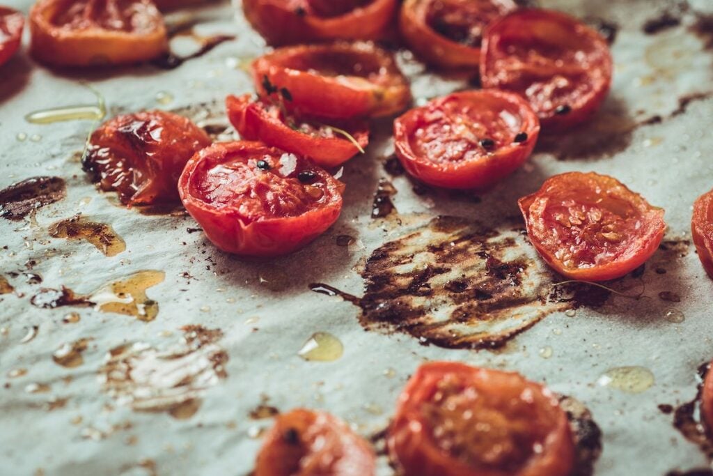 Slow roasted cherry tomatoes on baking parchment