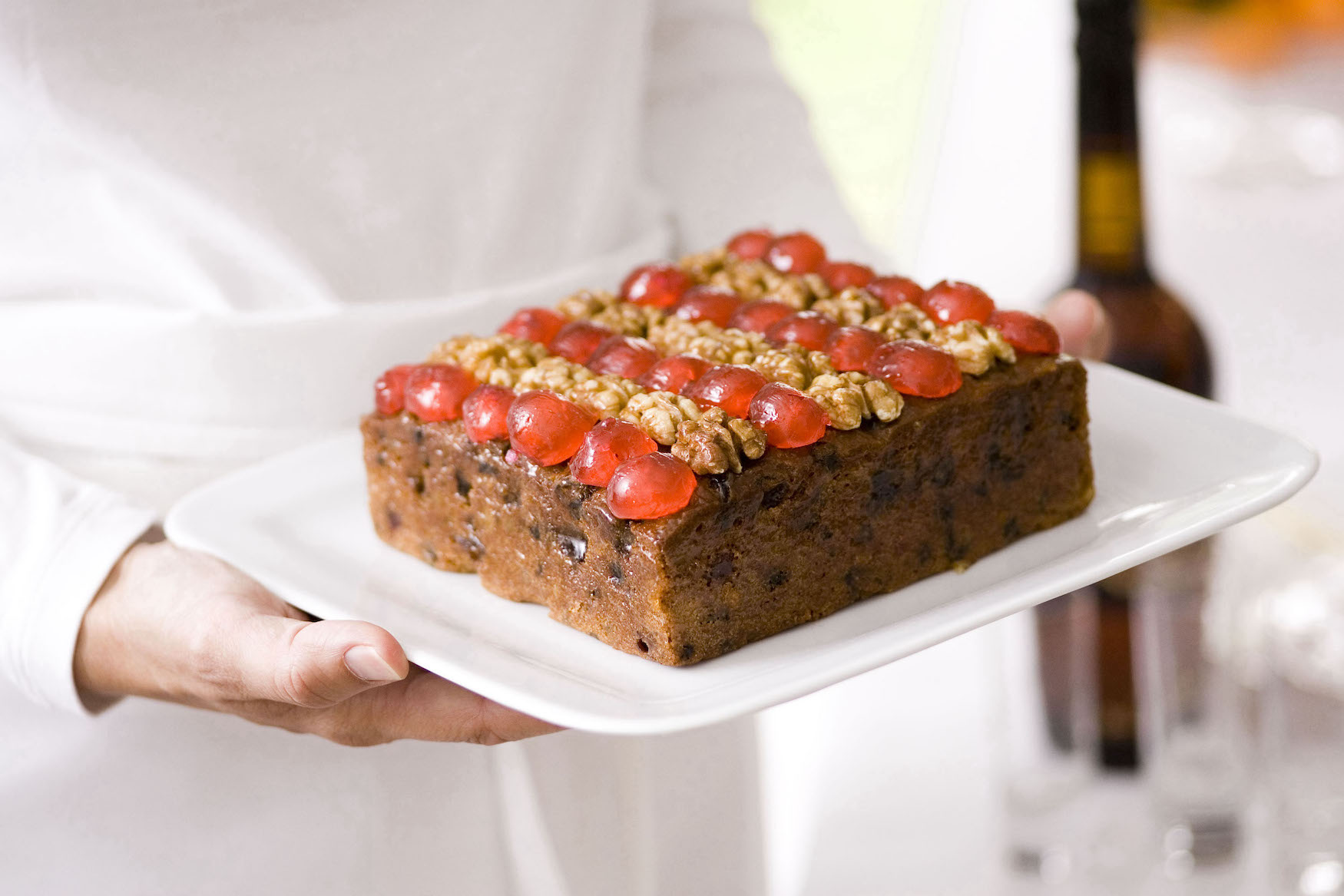 A medium Christmas cake on a white plate