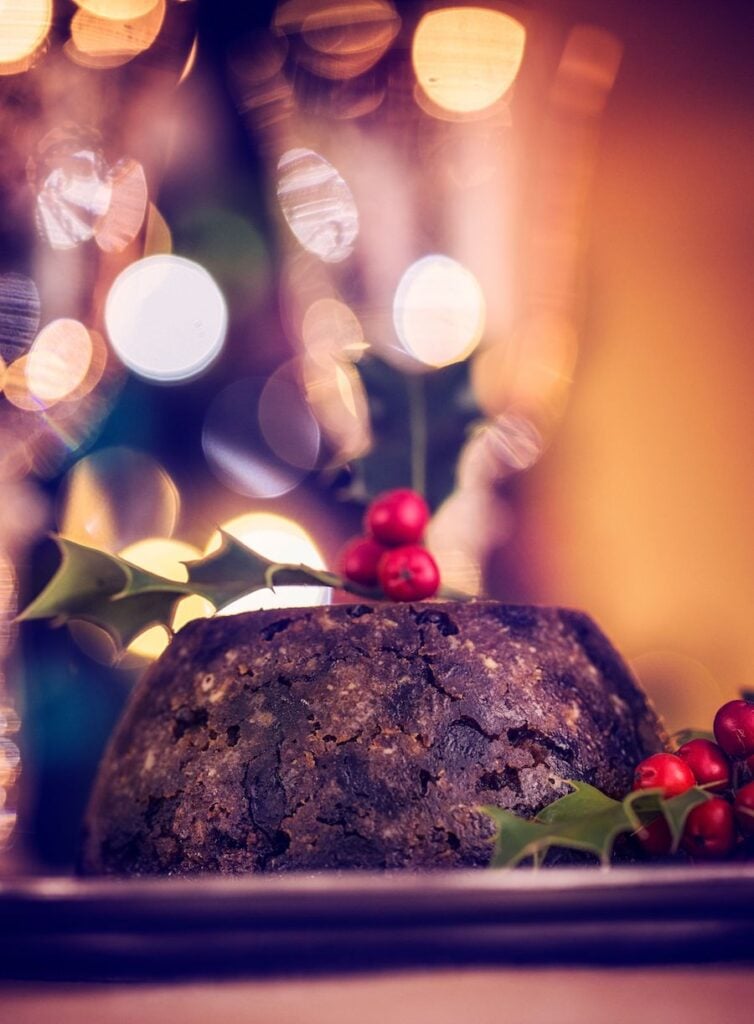 A Christmas Pudding with fairy lights in the background