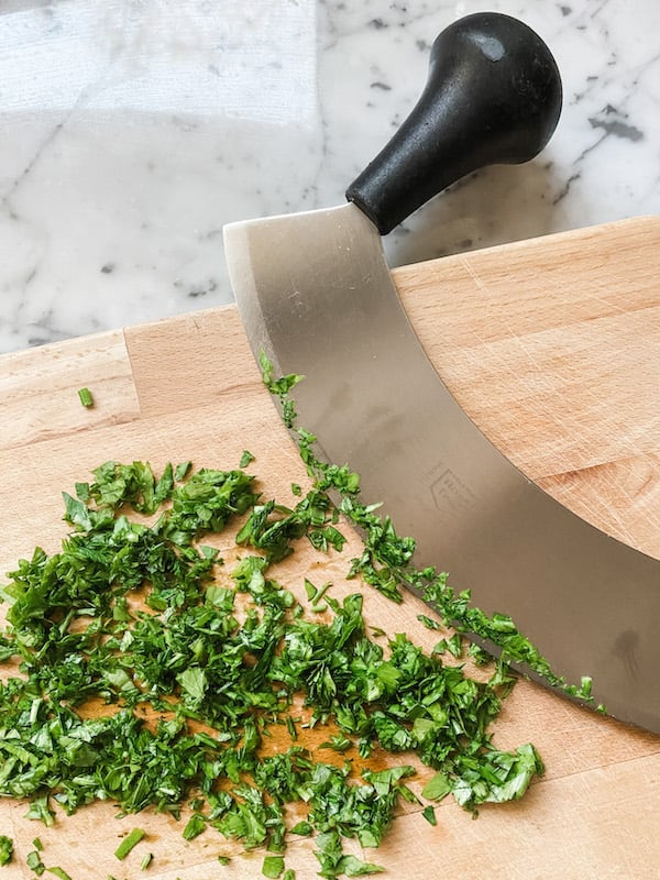 Chopped parsley as a garnish for Chicken, Chorizo and Chickpea Stew 