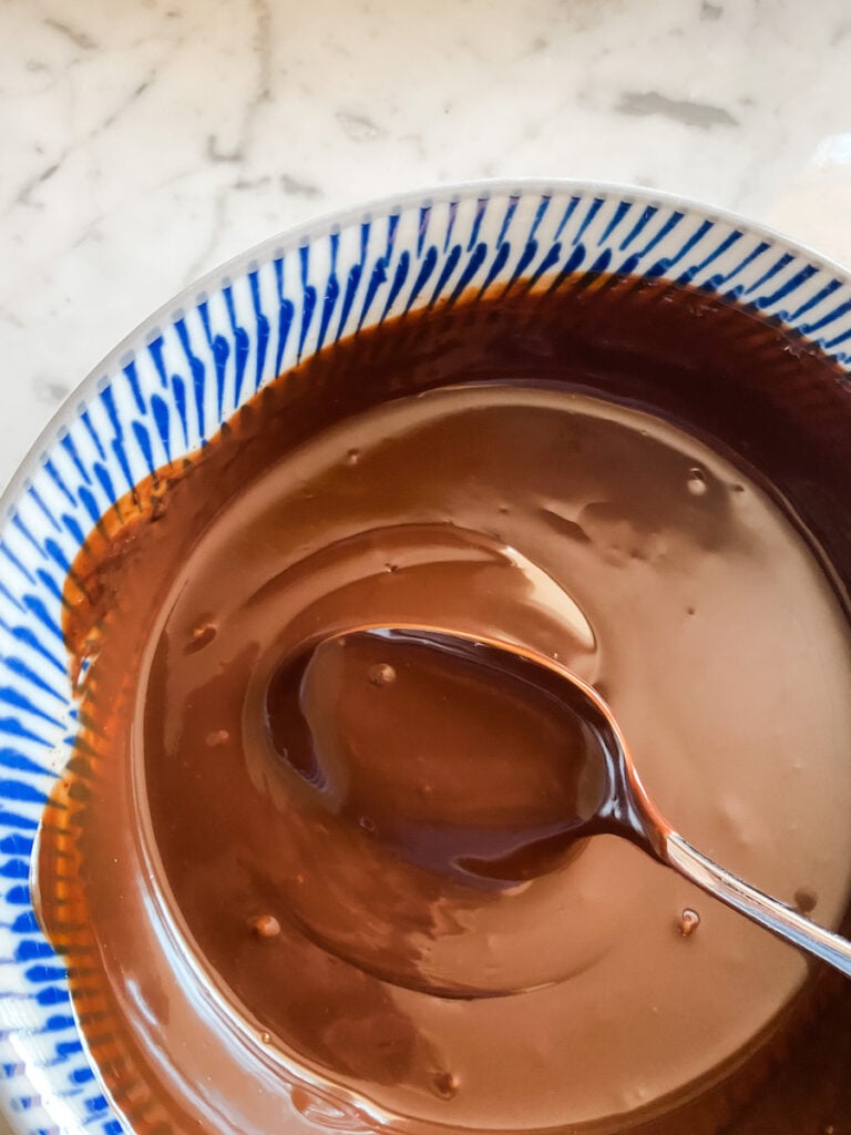 Chocolate ganache warm in a blue bowl