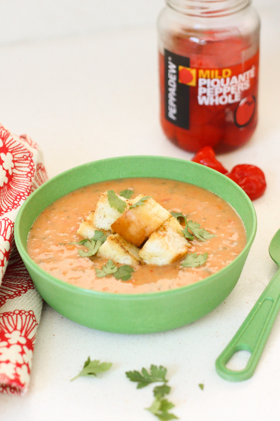 Spicy Peanut and Vegetable Soup in a green bowl