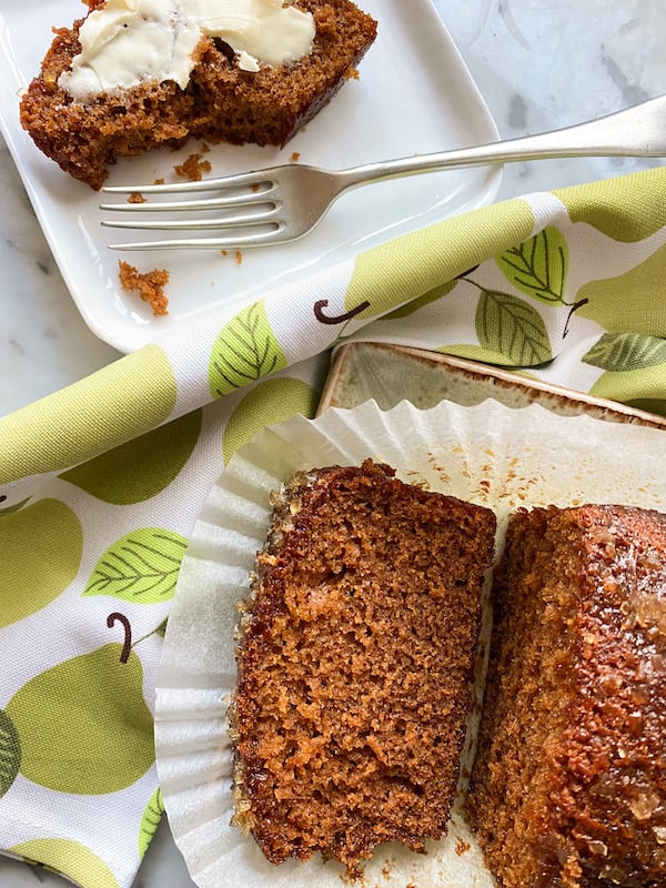 Sticky Golden Ginger Cake laid on a green and white napkin