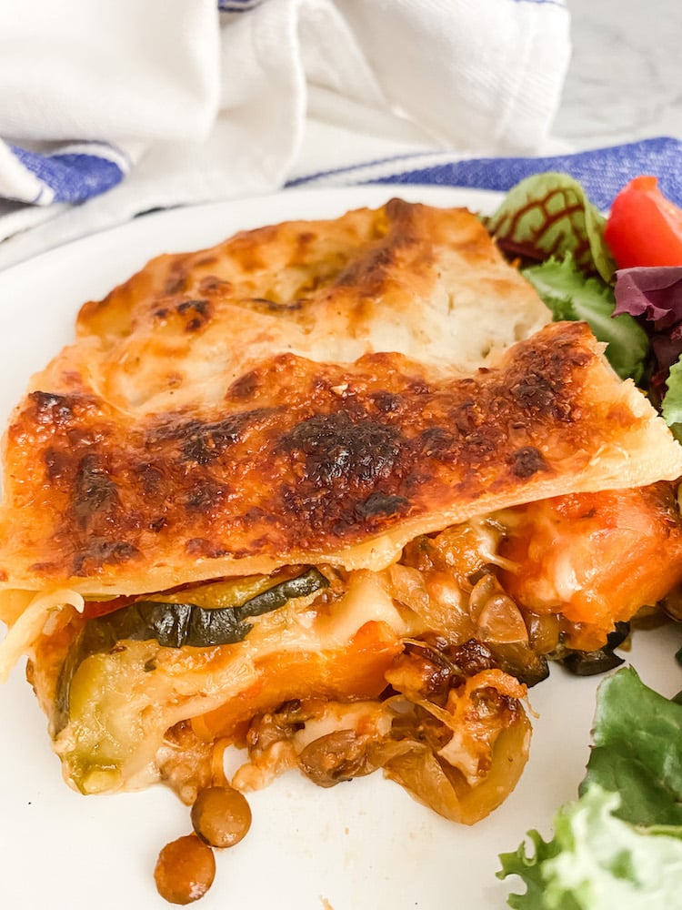 Roasted Vegetable and Lentil Lasagne on a white plate
