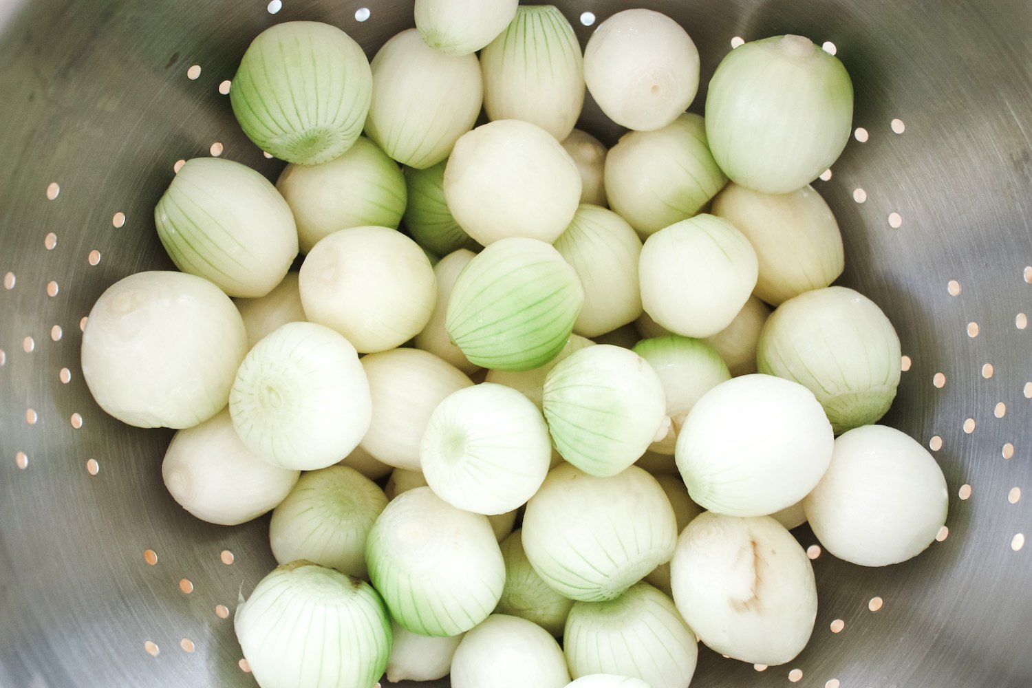 Peeled Onions in colander