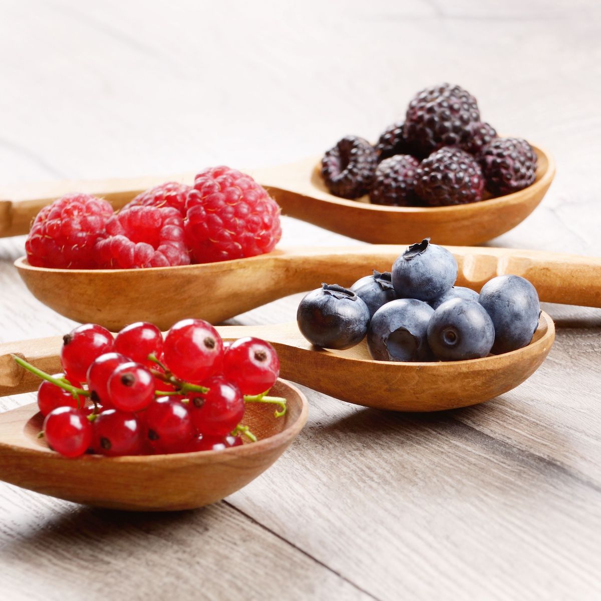 Berries on wooden spoons
